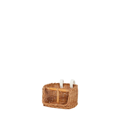 Wicker basket with candles on a white background