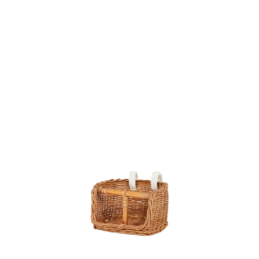 Wicker basket with candles on a white background