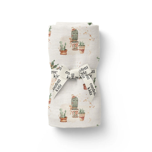 Folded fabric with cactus pattern on a white background