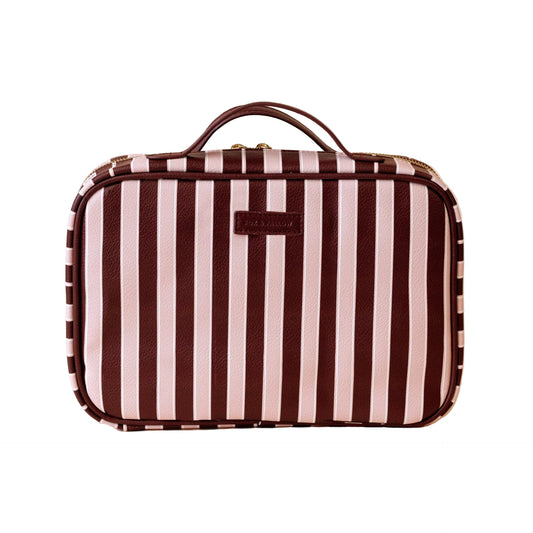 Striped suitcase with brown and white stripes on a beige background