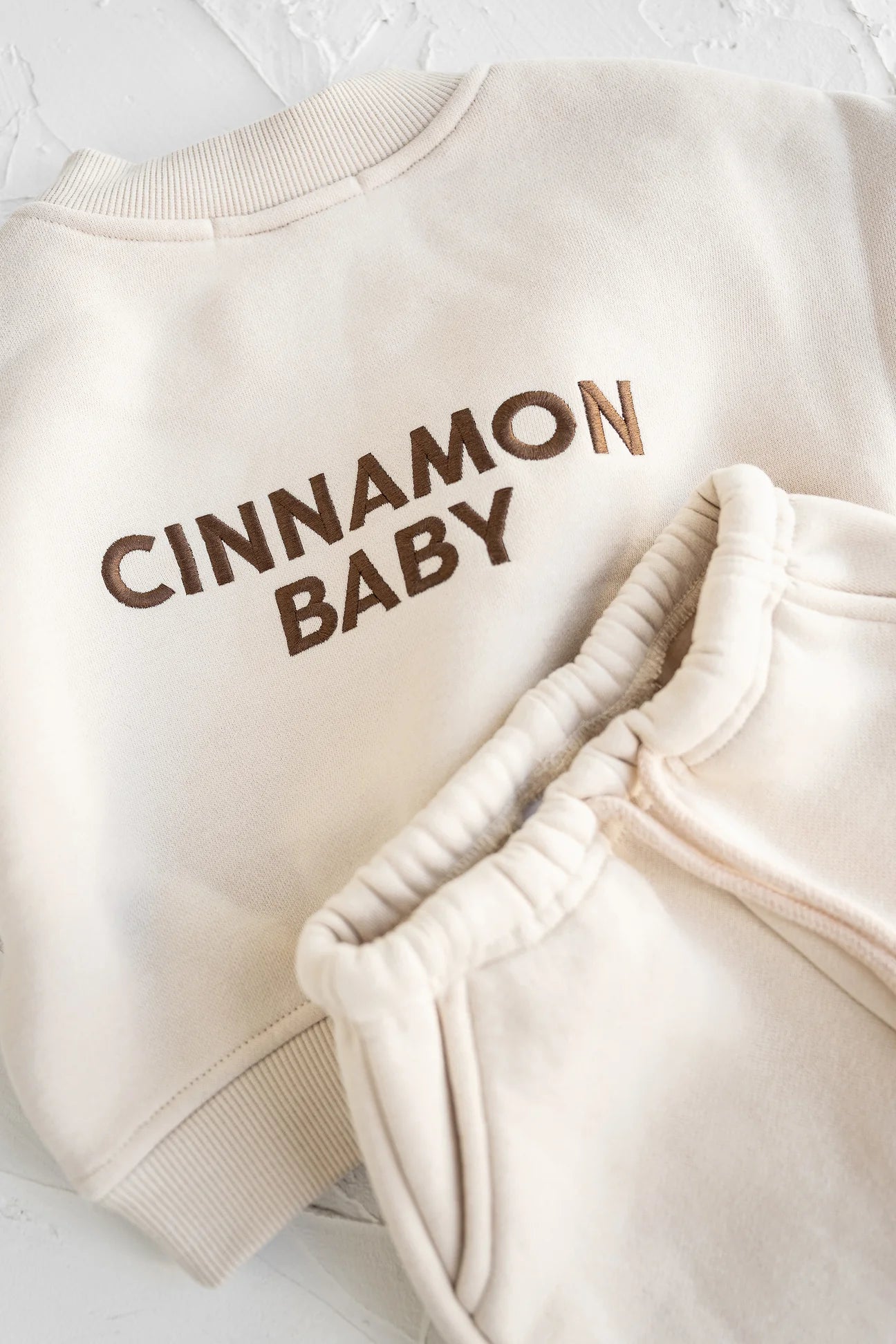 CINNAMON BABY LOGO TRACKSUIT - CREAM