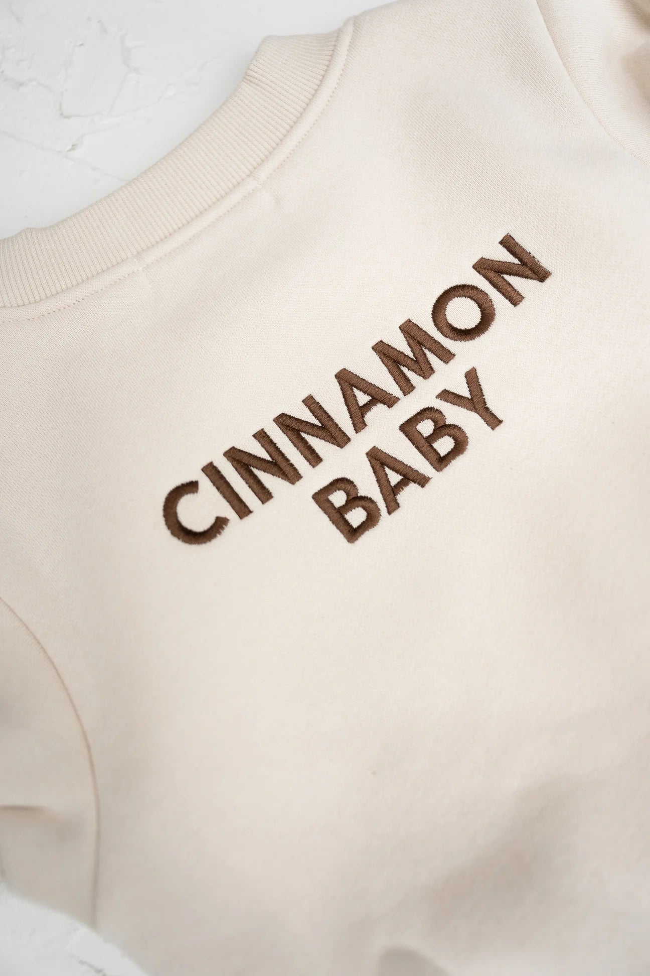 CINNAMON BABY LOGO ROMPER - CREAM