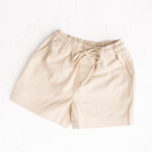 Beige shorts on a white background