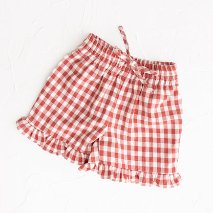 Red and white checkered shorts on a white background