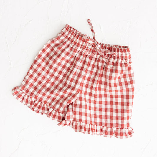 Red and white checkered shorts on a white background