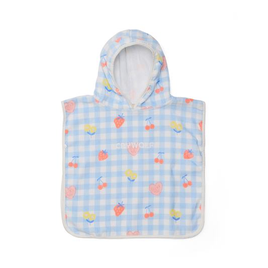 Children's poncho with hood and cherry pattern on a blue checkered background