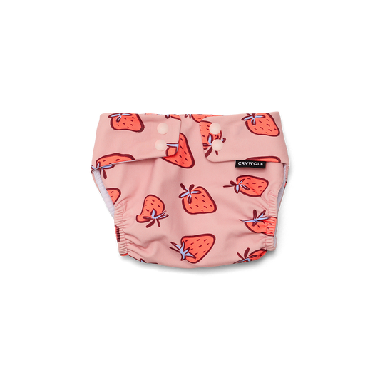Pink diaper with strawberry pattern on a white background