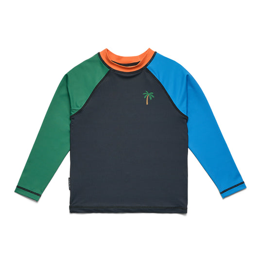 A long-sleeve kids' rash guard with a dark navy body, green right sleeve, blue left sleeve, and an orange collar, featuring a small embroidered palm tree on the left chest.