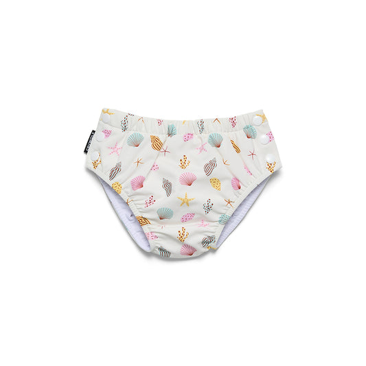 A pair of reusable cloth swim diapers with an all-over seashell and starfish pattern on a white background, featuring a light purple inner lining and snap closures.