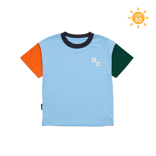A light blue short-sleeve ringer t-shirt with contrasting dark navy collar, bright orange left sleeve, and dark green right sleeve. A small white block logo is printed on the left chest.