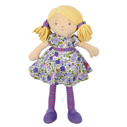 Plush doll with blonde hair, floral dress, and purple shoes on a white background