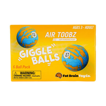 Front of the Fat Brain Toy Co. Air Toobz Giggle Balls packaging, showing a bright yellow box with two blue and orange striped air-powered balls and product text including '6 Ball Pack' and 'Ages 3 - Adult'.
