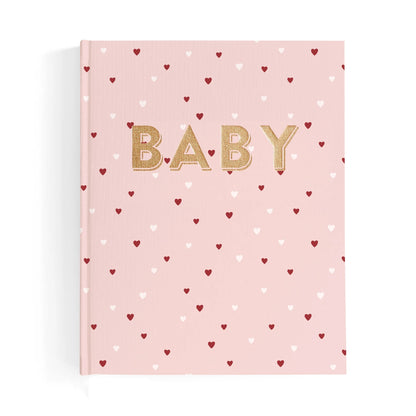 Pink book with gold 'BABY' text and heart patterns on a white background