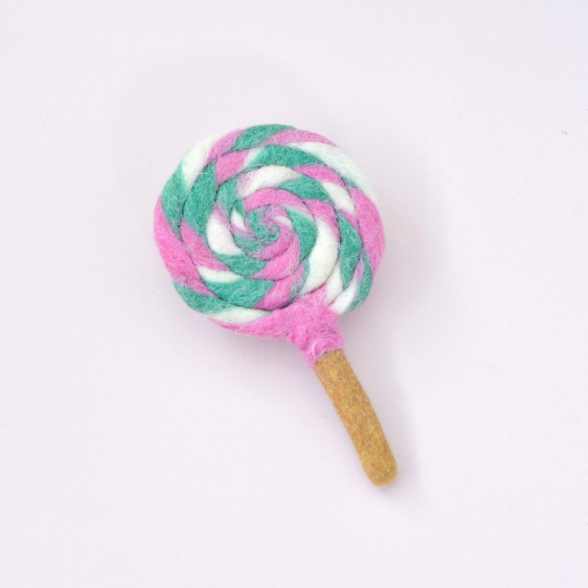 Lollipop-shaped toy with pink and green swirl pattern on a white background