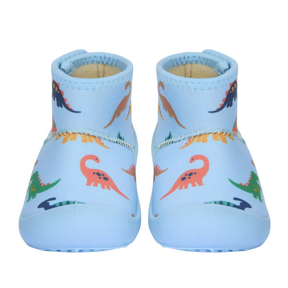 Pair of blue baby shoes with dinosaur pattern on a light gray background