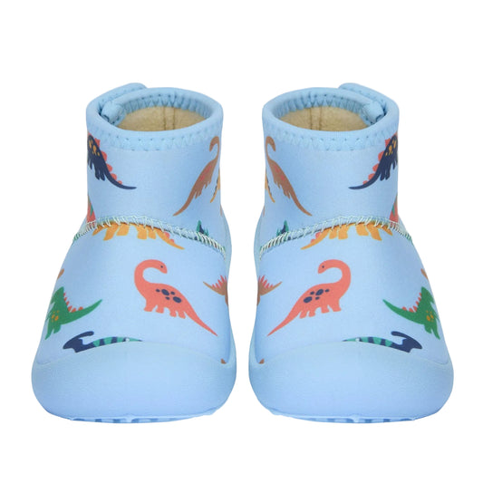 Pair of blue baby shoes with dinosaur pattern on a light gray background