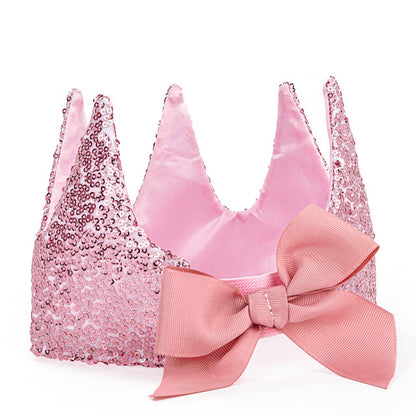 Pink bralette with sequin cups and a large bow on a white background