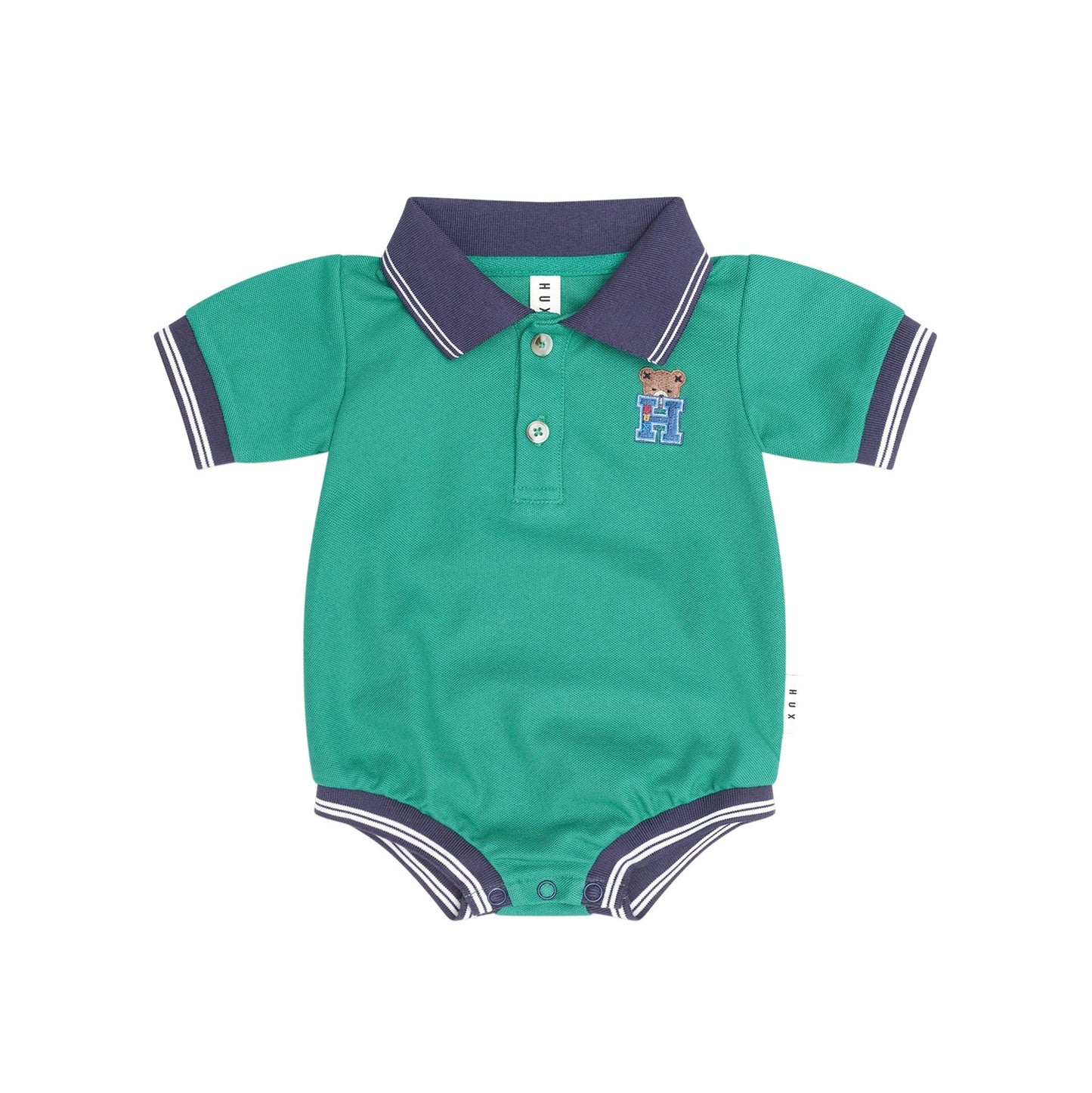A baby short-sleeve polo romper in teal green with a dark purple collar and sleeve trim, featuring a three-button placket and a small embroidered teddy bear logo on the chest.