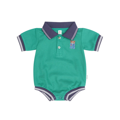 A baby short-sleeve polo romper in teal green with a dark purple collar and sleeve trim, featuring a three-button placket and a small embroidered teddy bear logo on the chest.