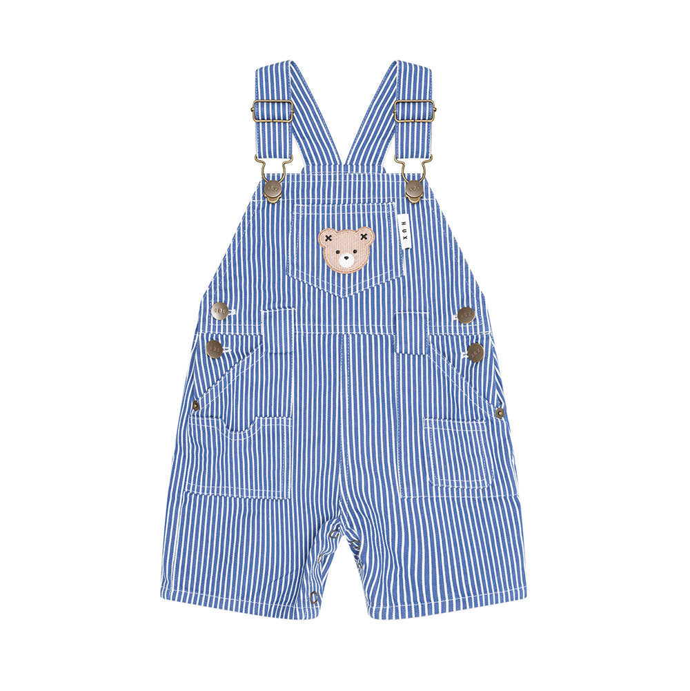 Blue and white striped baby overalls with a teddy bear face patch on the chest, adjustable shoulder straps, and front pockets, shown on a plain white background.