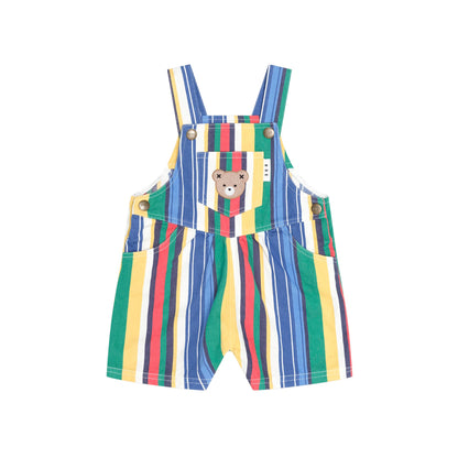 A baby's short overall romper with colorful vertical stripes in green, blue, yellow, red, and white. It features a central pocket with a cartoon bear face patch and adjustable shoulder straps.
