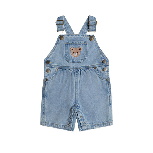 Light blue denim overalls with a bear design on a white background