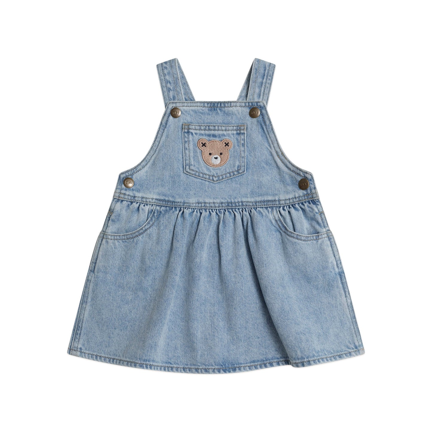 Denim pinafore dress with a bear patch on a white background