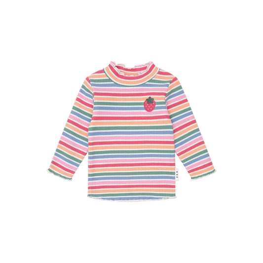 Multicolored striped shirt with a small apple design on a light pink background
