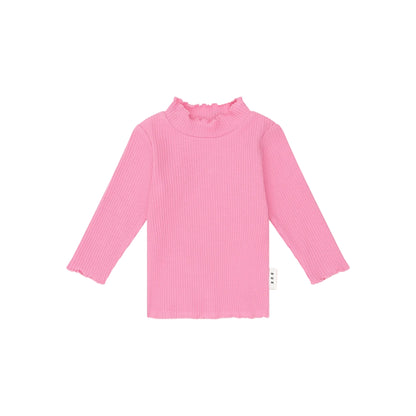 Pink ribbed long-sleeve top on a light pink background