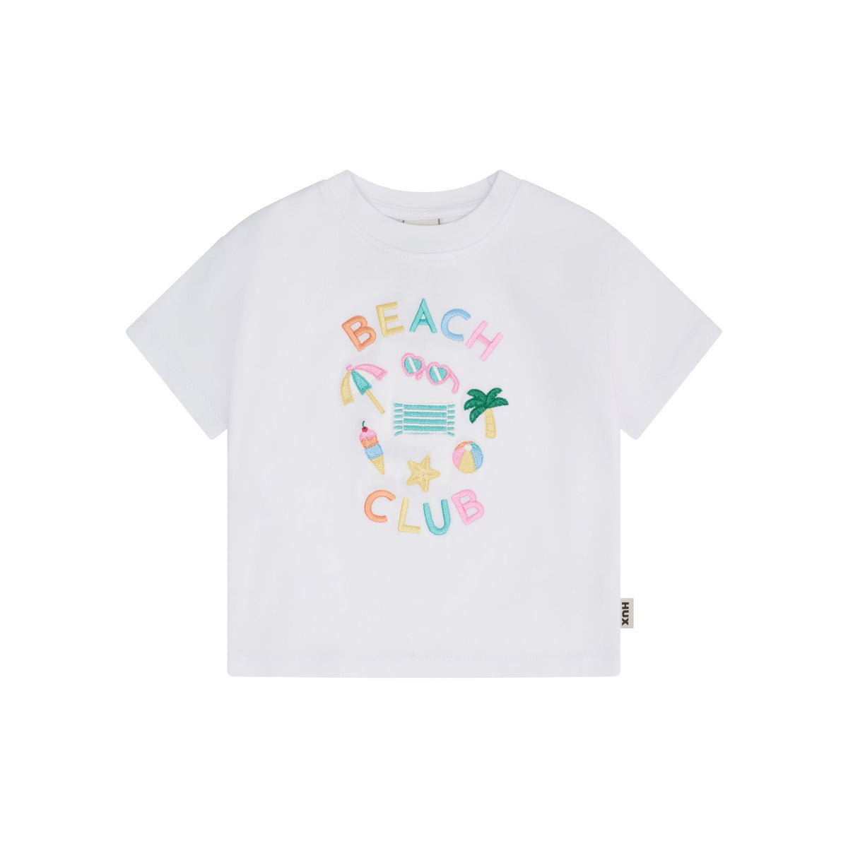 A white short-sleeve crewneck t-shirt featuring a colorful 'BEACH CLUB' graphic on the front with beach-themed illustrations, shown against a plain white background.