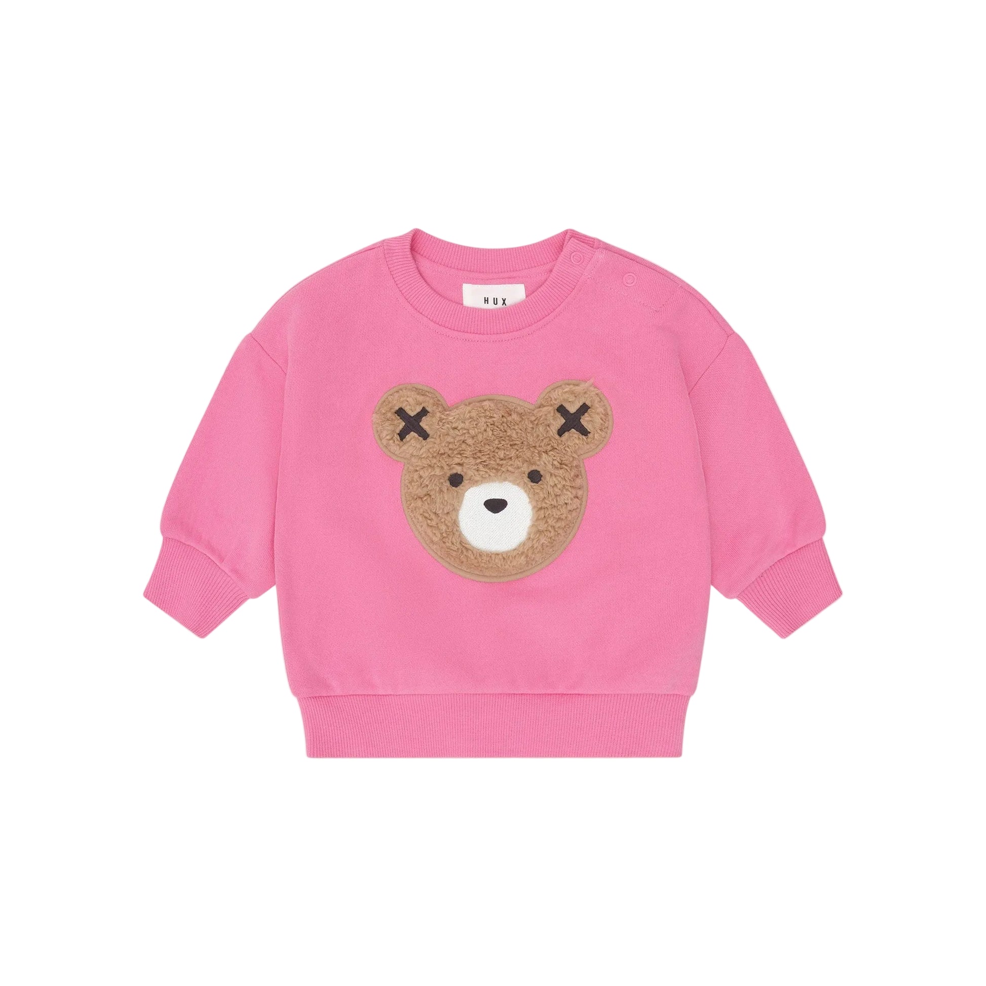 Pink sweatshirt with a bear face design on a light pink background