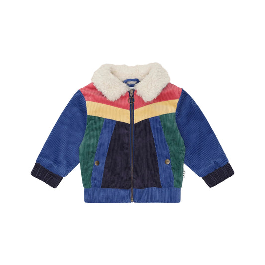 Colorful children's jacket with a white fur-lined hood on a beige background