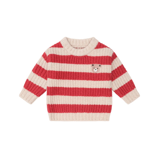 Red and white striped sweater on a beige background