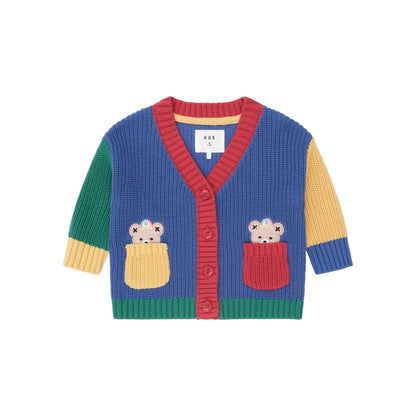 Colorful children's cardigan with bear designs on a beige background