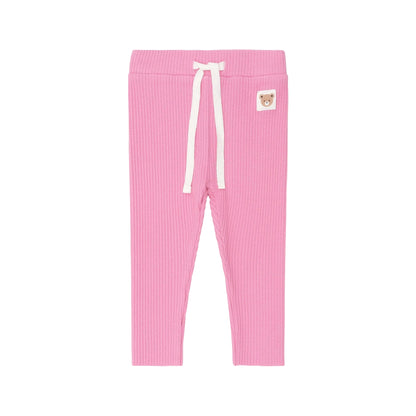 Pink ribbed leggings with a white drawstring on a light pink background
