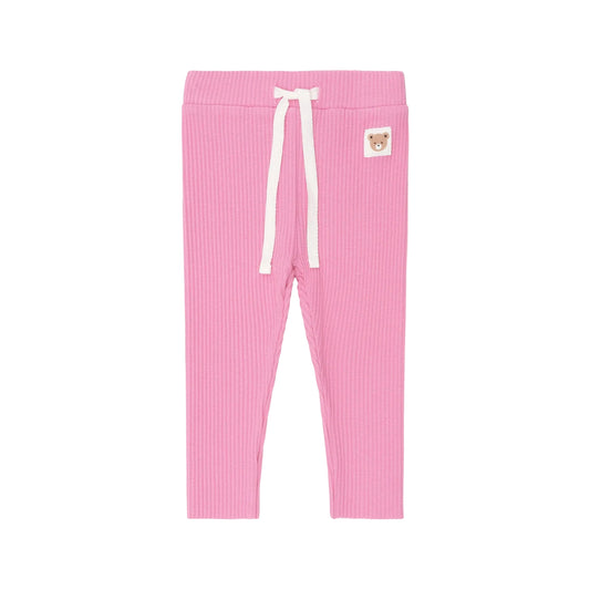 Pink ribbed leggings with a white drawstring on a light pink background