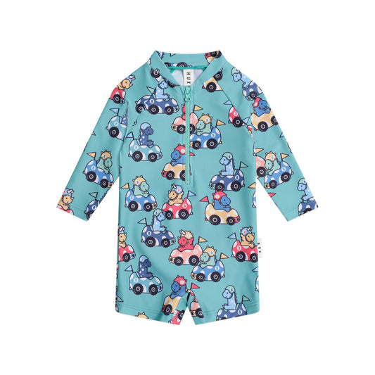 Children's shirt with car and animal pattern on a light blue background