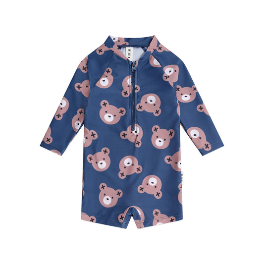 Blue children's swimsuit with bear pattern on a white background