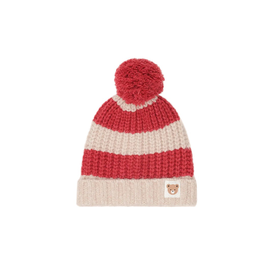 Knitted hat with red and beige stripes on a white background