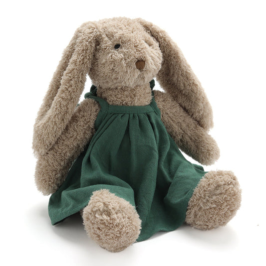 Plush bunny toy wearing a green dress on a white background