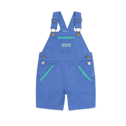 A pair of blue denim baby shorts with adjustable suspenders, featuring two front pockets with light green contrast stitching and a small white embroidered 'BOO' on the chest, shown against a plain white background.