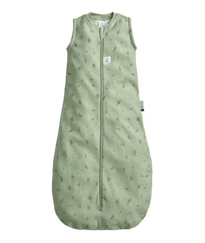 Green baby sleeping bag with subtle pattern on a white background
