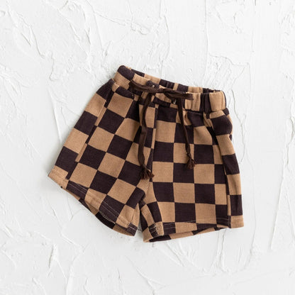 Checkered shorts with a tie waist on a white background