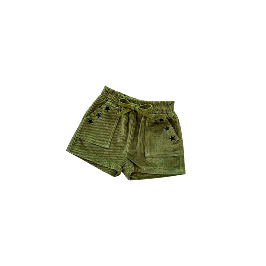 Green shorts with star patterns on a white background