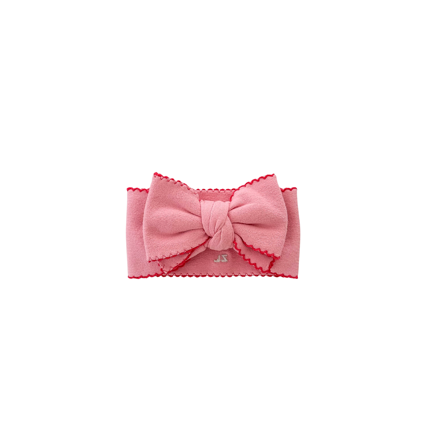 Pink headband with a bow on a white background
