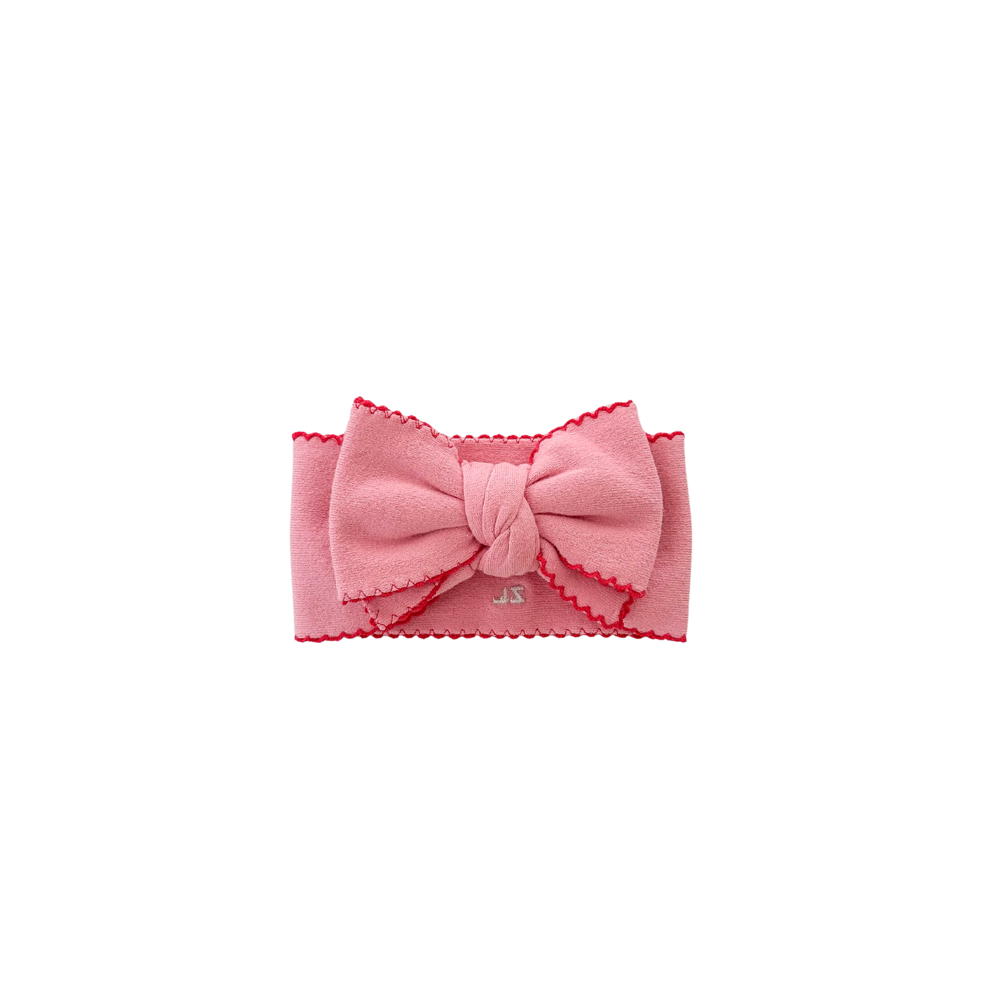 Pink headband with a bow on a white background