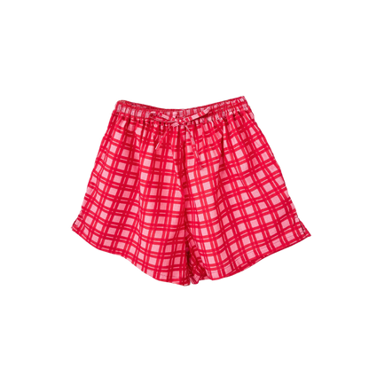 Red plaid shorts on a white background
