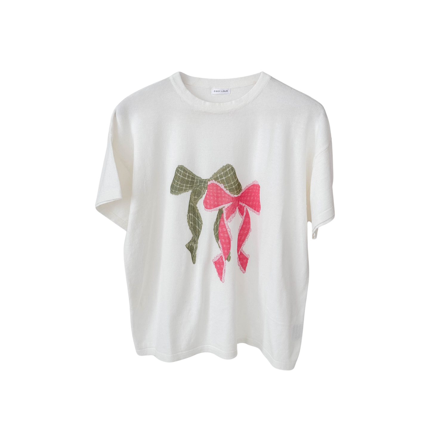 White t-shirt with decorative bows on a white background