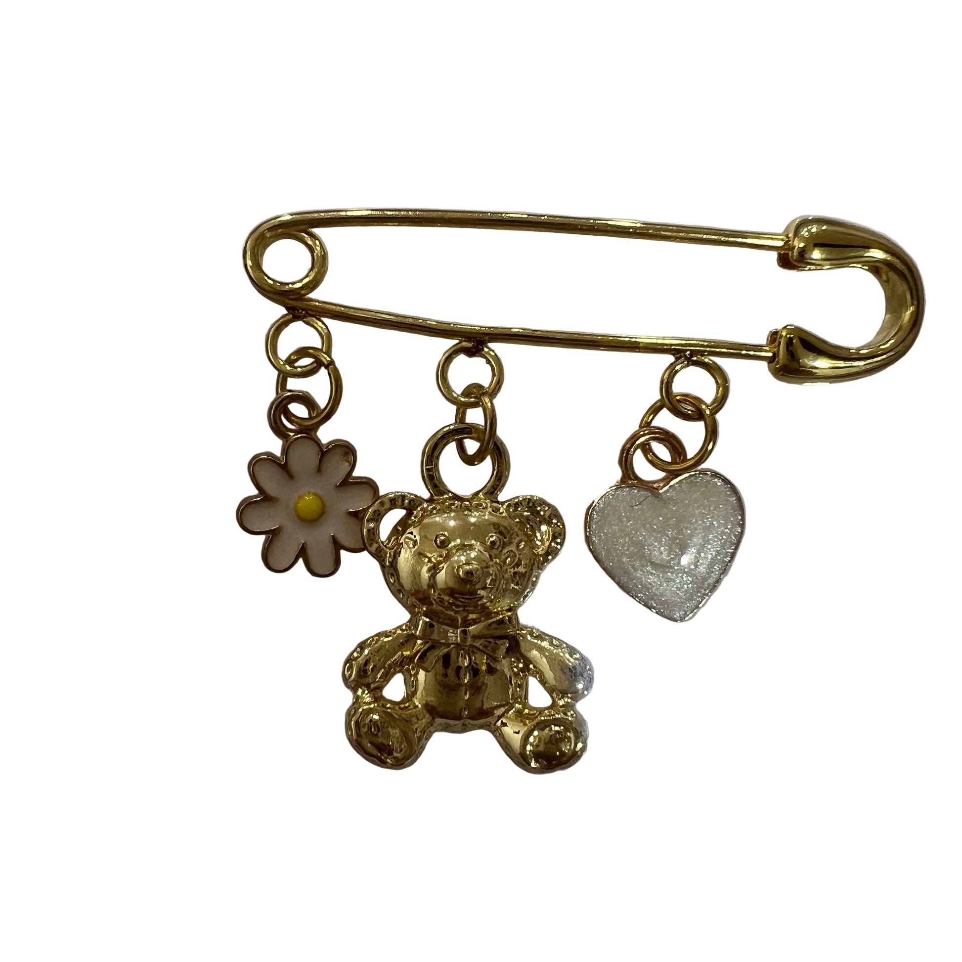 Gold-colored brooch with teddy bear, flower, and heart charms on a white background