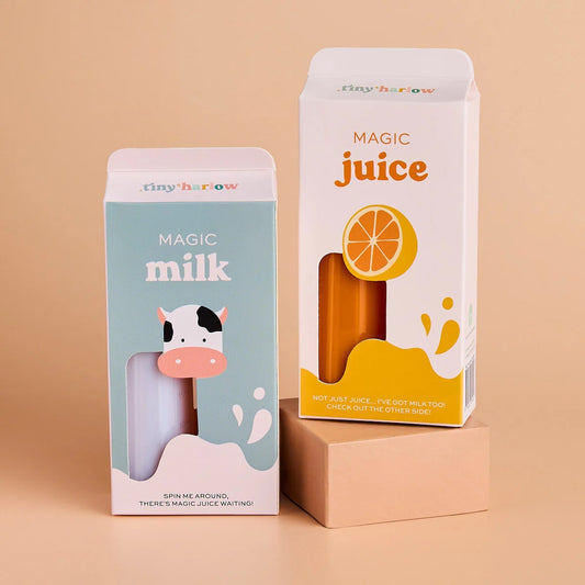 Two packaging boxes for 'Magic Milk' and 'Magic Juice' on a beige background